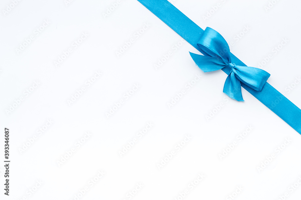 Blue ribbon with bow isolated on white for gift box. Top view, copy space Blue ribbon with bow isolated on white for gift box. Top view, copy space