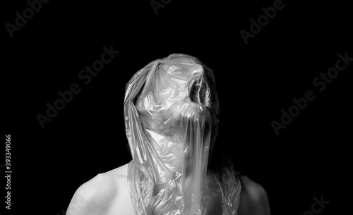 portrait strangulation, plastic bag on head photo