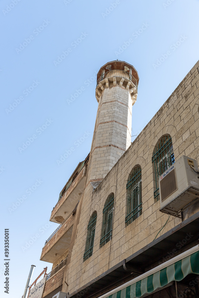 High minaret on El Wad HaGai Street  in the old city of Jerusalem in Israel