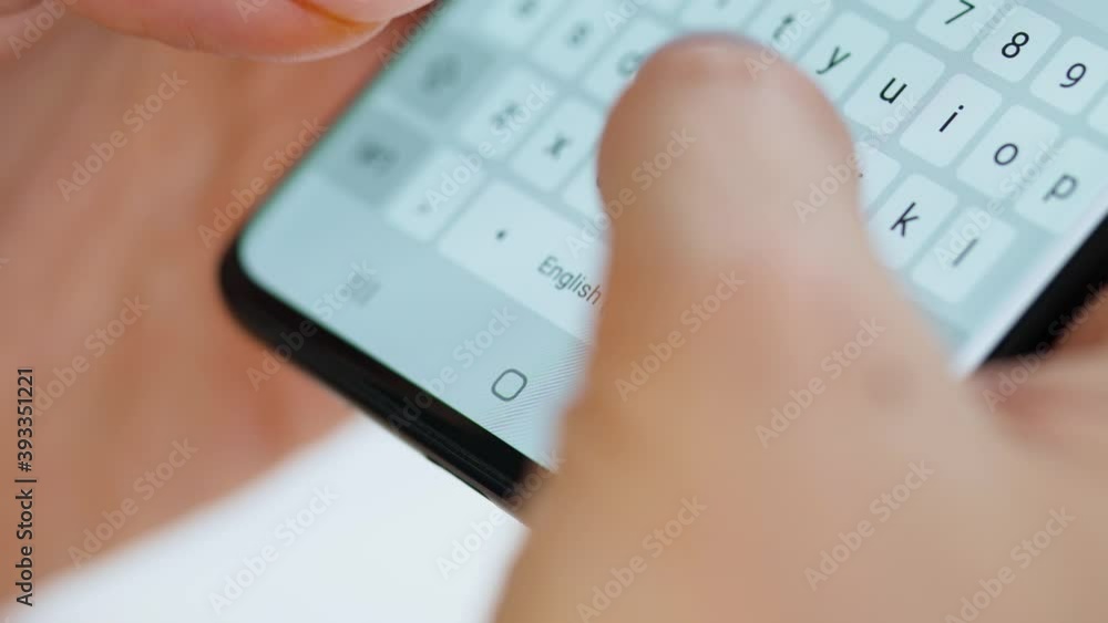 Hands typing text on smartphone close-up Hands typing text on smartphone close-up