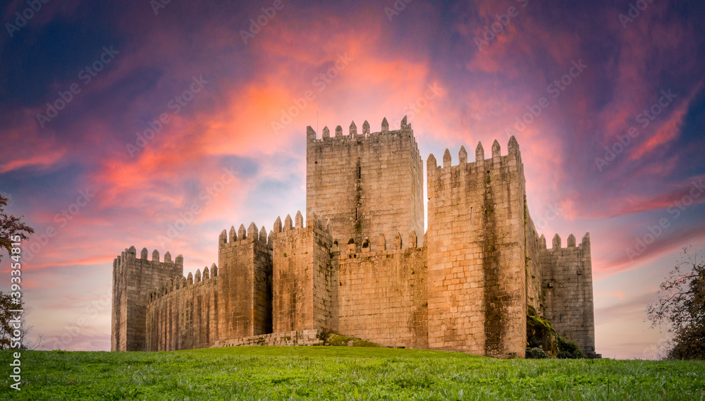 Low angle view of Guimarães castle at sunset - Portugal.