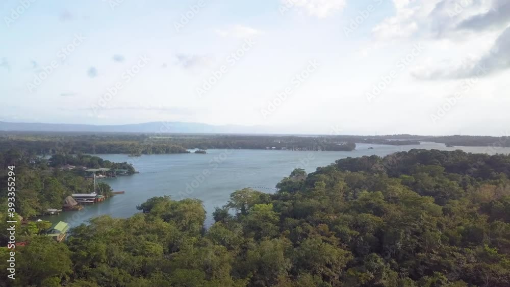 Aerial forward shot of famous Rio Dulce River in Guatemala during sunny day in nature. Aerial forward shot of famous Rio Dulce River in Guatemala during sunny day in nature.