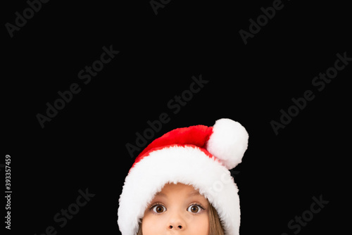 Beautiful little girl in a Christmas hat. © Юлия Дьякова