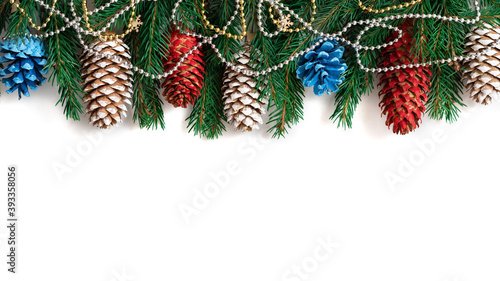 Fir branches and cones with decorations for Christmas.