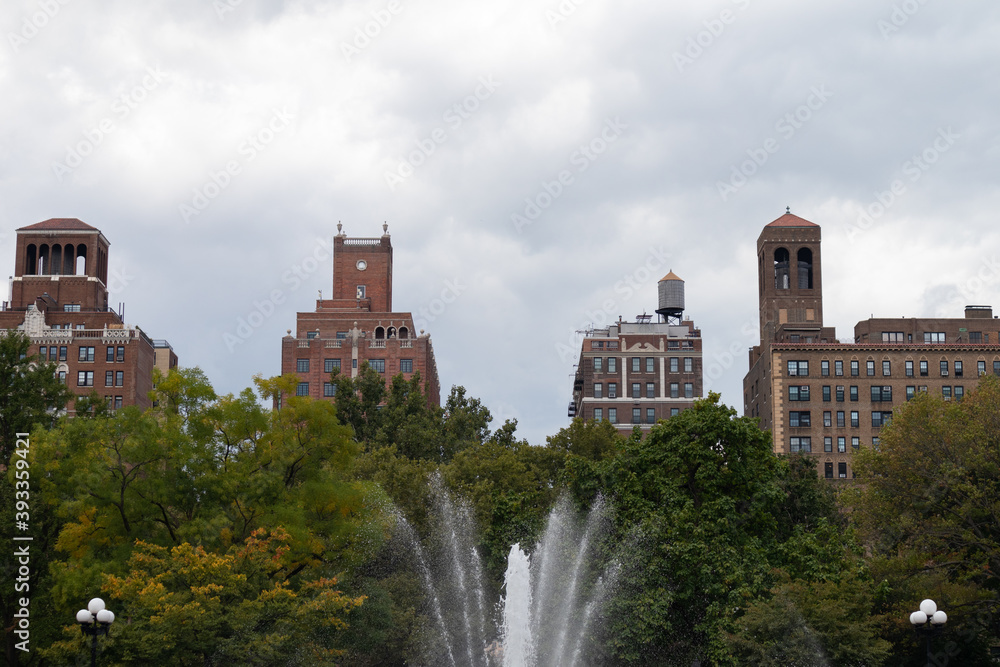 Fountain at Washington Square Park with Skyscrapers during Fall in Greenwich Village of New York City