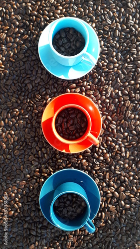 Coffee Cups on Coffee Beans © Alaa