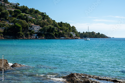 Summer vacation on French Riviera, crystal clear azure blue water of  Mediterranean sea in Saint Clair near Le Lavandou, Var, Provence, France © barmalini