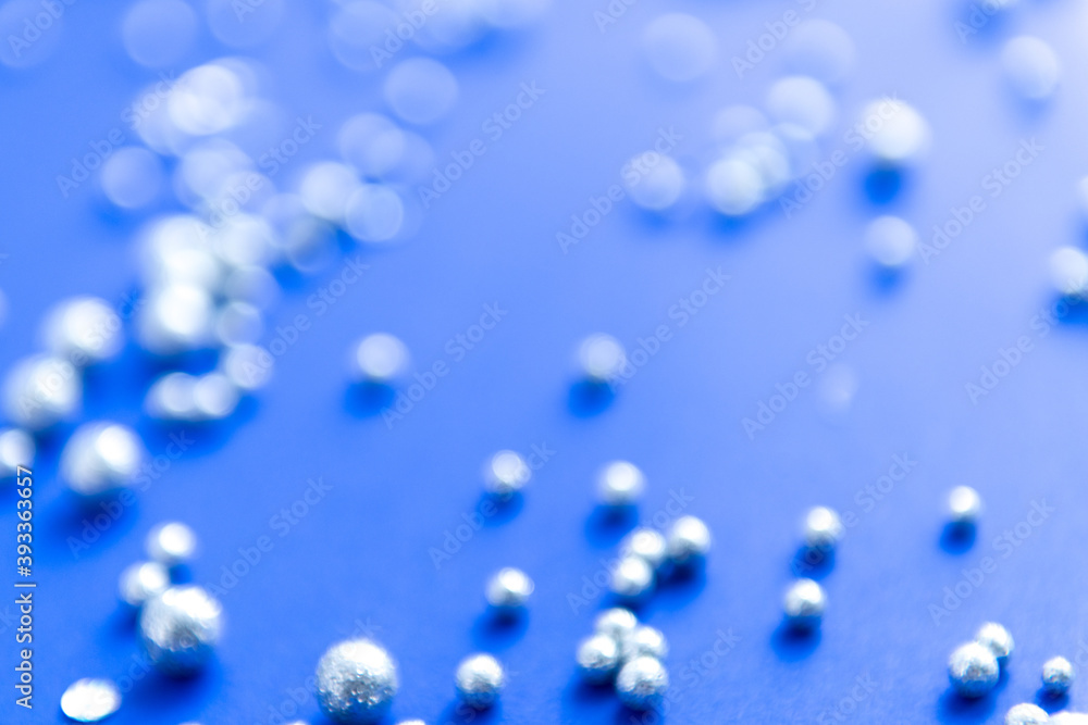 abstract background with silver decorative balls on a color background abstract background with silver decorative balls on a color background