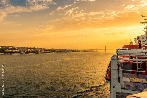 Lisbon on the shores of the Tagus river bathed in the golden early morning light at sunrise in Autumn © Nicola