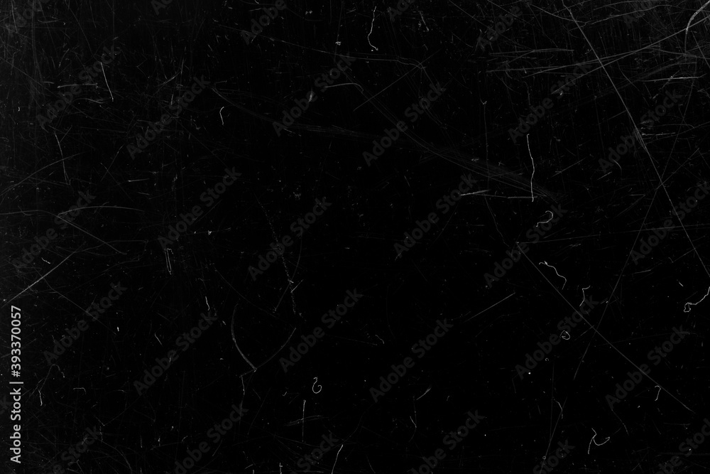 Black film with scratches. Abstract background.