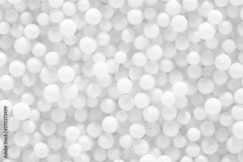 White balls background, soft white and gray pearls texture. Abstract backdrop, close-up.