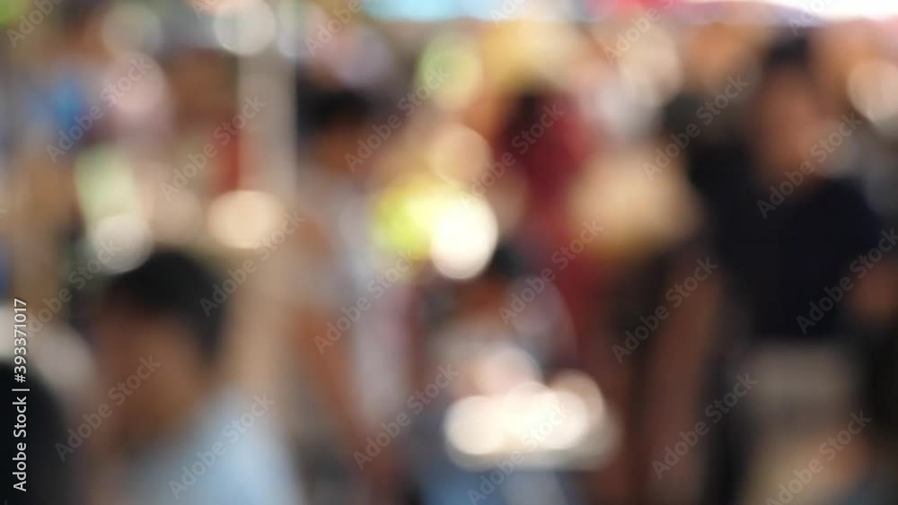 Slow motion speed blur scene on group of traveler traveling in local craft market, tourist relax walking and enjoy shopping in street food shop, buyer look for goods to buy