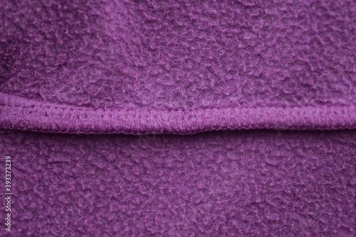 red lilac texture of fabric from a piece of wool with a seam