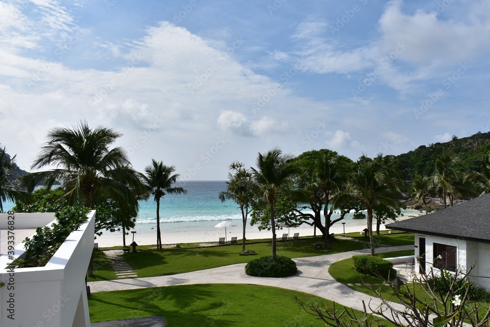 the beautiful landscape of luxury resort .coconut tre green meadow white sand beach  ,wave,  blue sky  and three qay junction at racha yai island phuket thailand