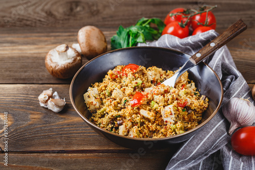 Couscous with turkey, tomatoes, champignon mushrooms and avocado.