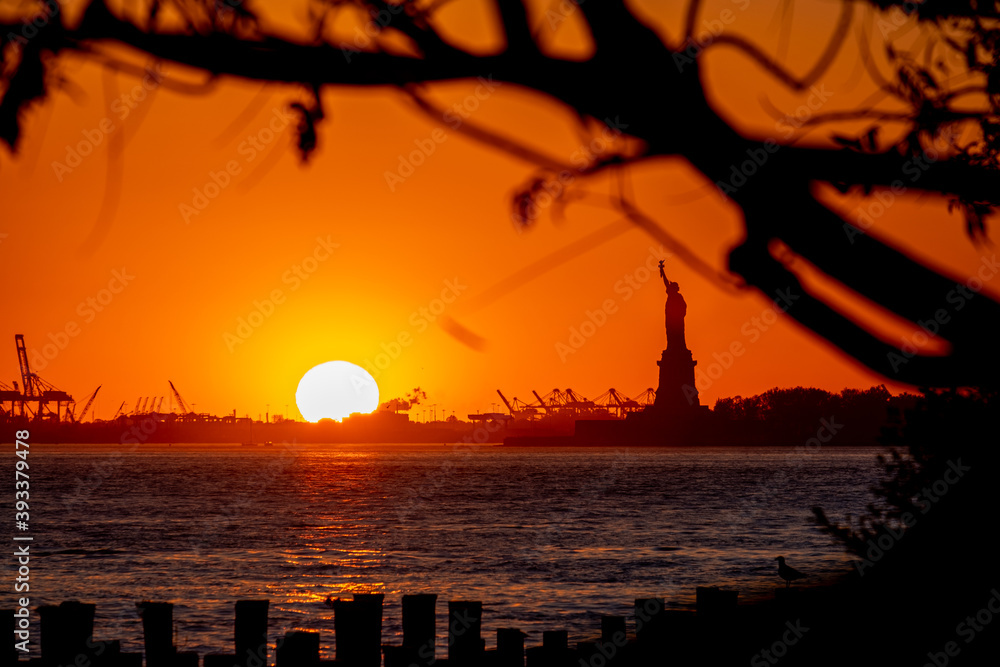 New York City - USA - Nov 4 2020: Beautiful Sunset Silhouettes of Statue of Liberty of New York