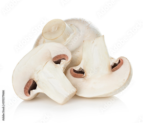Fresh mushrooms champignon and half isolated on white background with clipping path