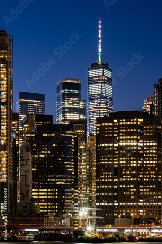 New York City - USA - Nov 4 2020: Financial District Buidling on the East River at dusk © Edi Chen