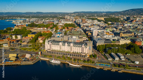 Oslo, Norway. Beautiful panoramic aerial view photo from flying drone for Oslo city center. Against the background of the sea, mountains and blue sky on a sunny summer day. (Series)