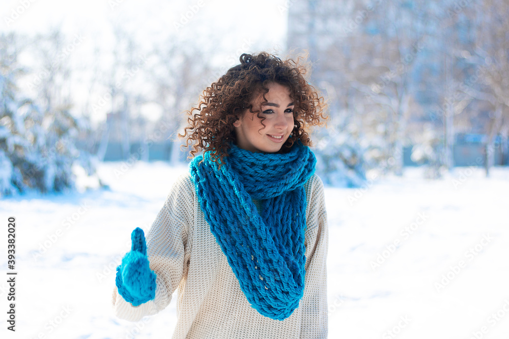 Young beautiful girl has fun in snowy weather on new year holidays Young beautiful girl has fun in snowy weather on new year holidays