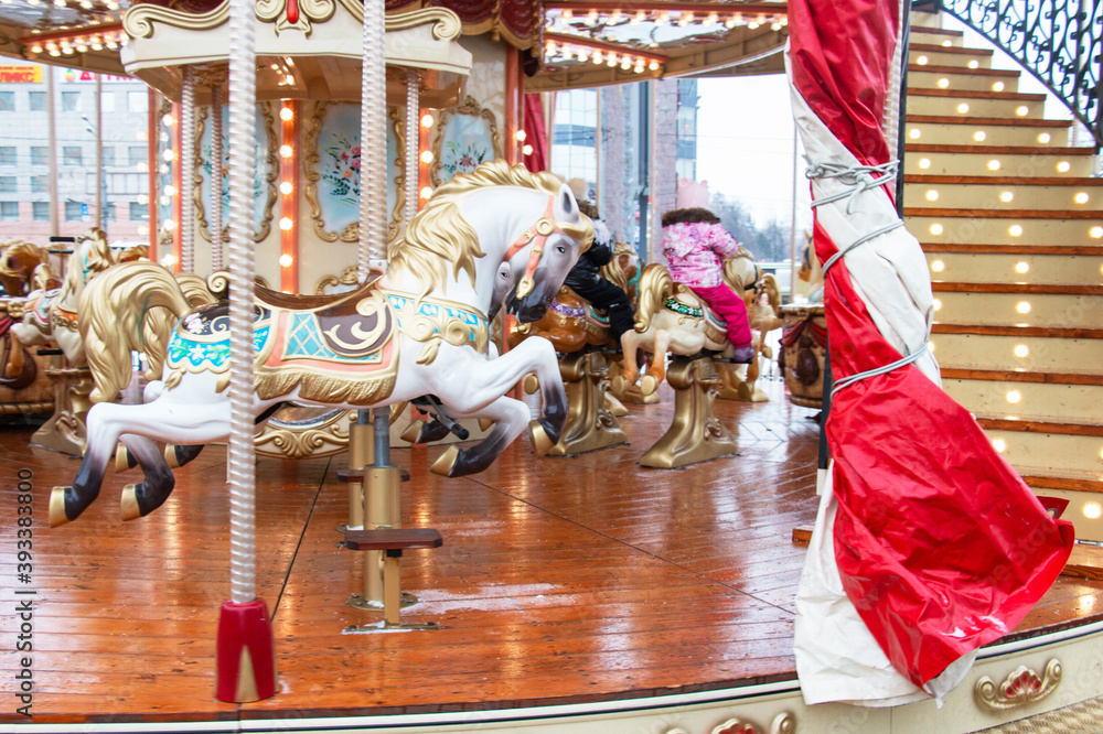 Carousel! Horses at the old carnival, people have fun at Christmas!