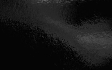 Black foil background with highlights and uneven texture