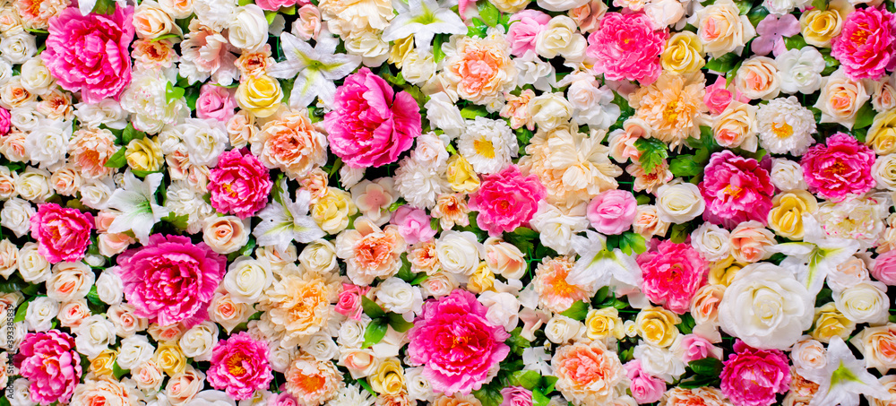 Background Flowers. Pano of artificial flowers. delicate palette, bright, multi-colored, rich color
