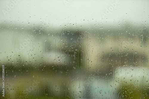 Beautiful view of raindrops running on window glass. Beautiful nature backgrounds.