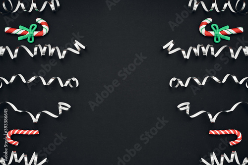 New Year's, festive decor on a black background. Copy space, flat lay, mock up, top view.