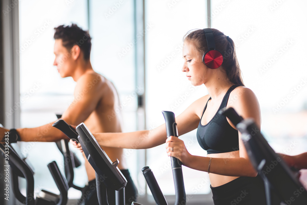 beautiful girl and her well-built boyfriend trainer, They are happy to see each othr in the gym. Young people are ready to start their workout beautiful girl and her well-built boyfriend trainer, They are happy to see each othr in the gym. Young people are ready to start their workout