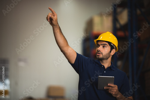 Man warehouse worker with a...