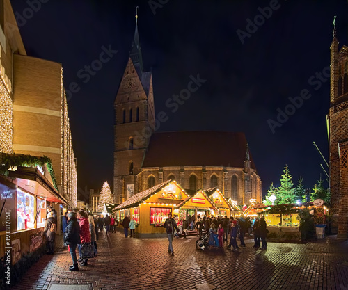 Hannover, Germany. Panoramic view of Christmas Market around Marktkirche (Market Church) in night.