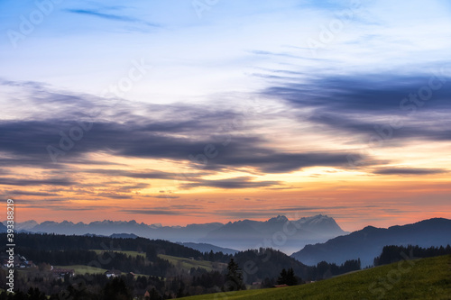 Sunset over Mount Saentis in Swiss Alps with Bregenzerwald, Austria, Vorarlberg, in foreground