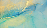 Art Abstract watercolor flow blot painting. Blue and Gold Color canvas marble texture background. Alcohol ink.