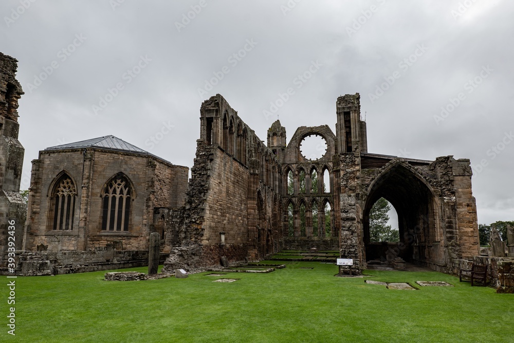 Fototapeta premium The courtyard of ancient Elgin Cathedral ruins at typical Scottish cloudy weather