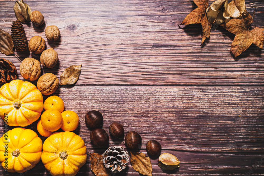 Happy Thanksgiving Day with pumpkin and nut on wooden table Happy Thanksgiving Day with pumpkin and nut on wooden table