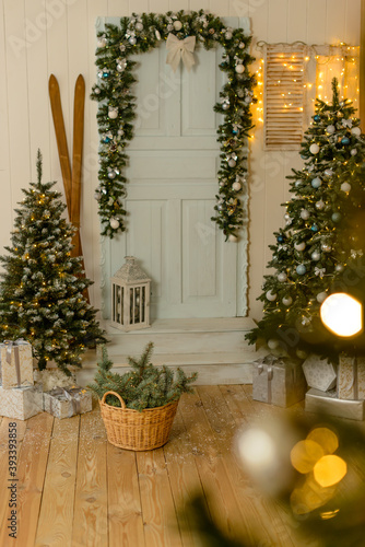 Beautiful holdiay decorated room with Christmas tree with presents under it