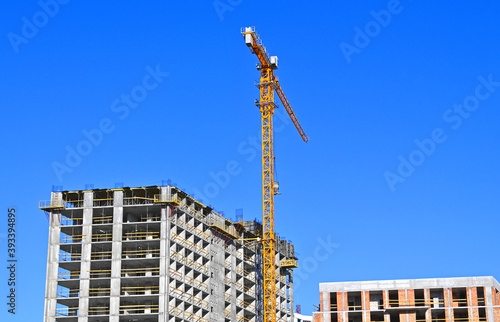 Crane and highrise construction site © Unkas Photo