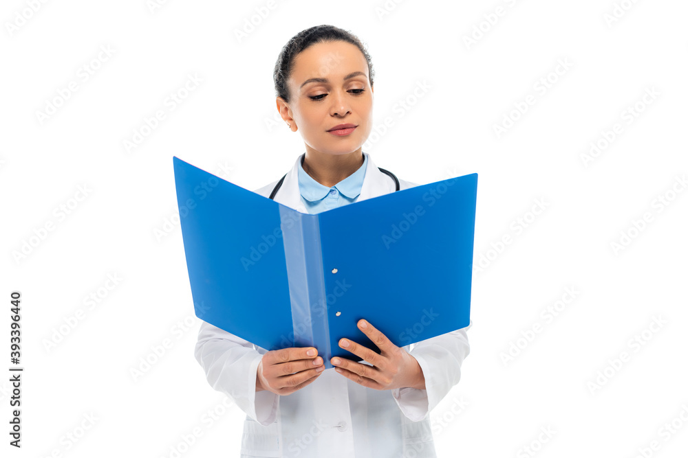African american doctor looking at paper folder isolated on white African american doctor looking at paper folder isolated on white