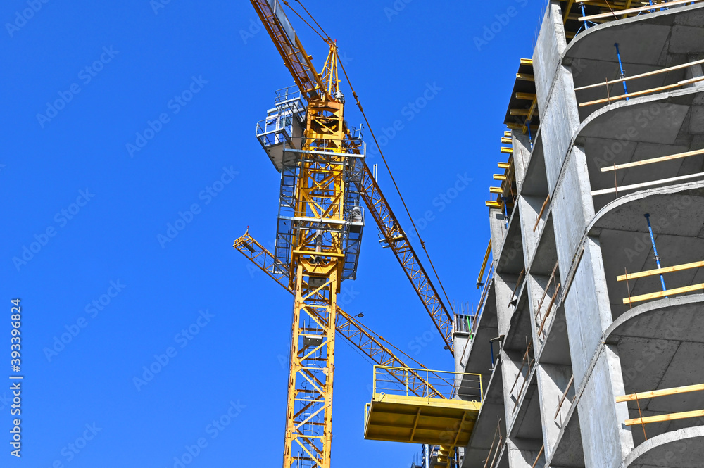 Fototapeta premium Crane and highrise construction site