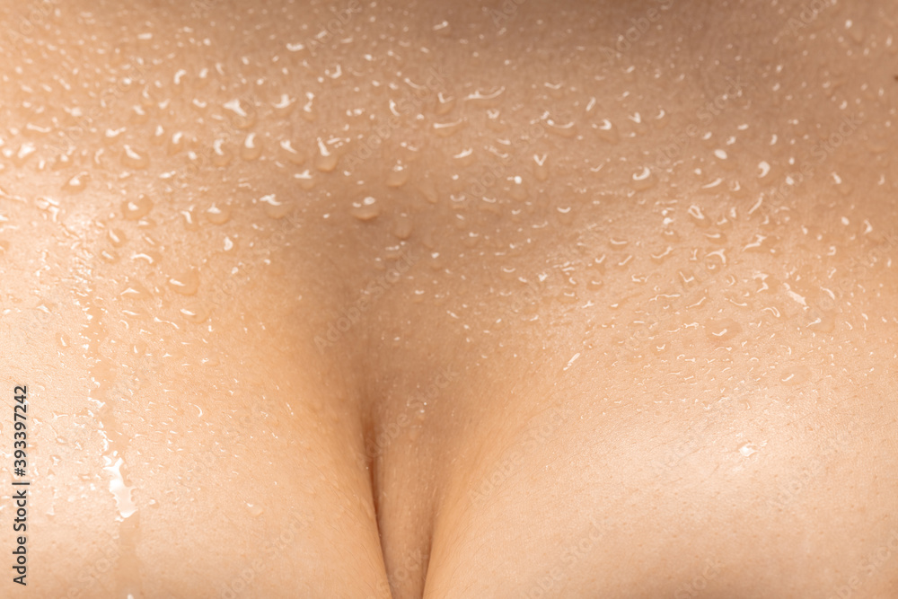 Fototapeta premium Chest, drops. Close up portrait of beautiful jewish female model. Parts of face and body. Beauty, fashion, skincare, cosmetics, wellness concept. Well-kept skin aesthetic, fresh look, details.