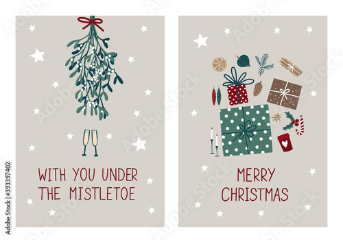 Cute greeting cards or poster for Merry Christmas. Text: With you under the mistletoe. Holiday symbols: mistletoe, candles, gift, candy. Scandinavian style hand drawing.