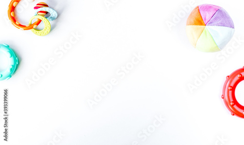 Baby accessories and toys on white background top view mock up