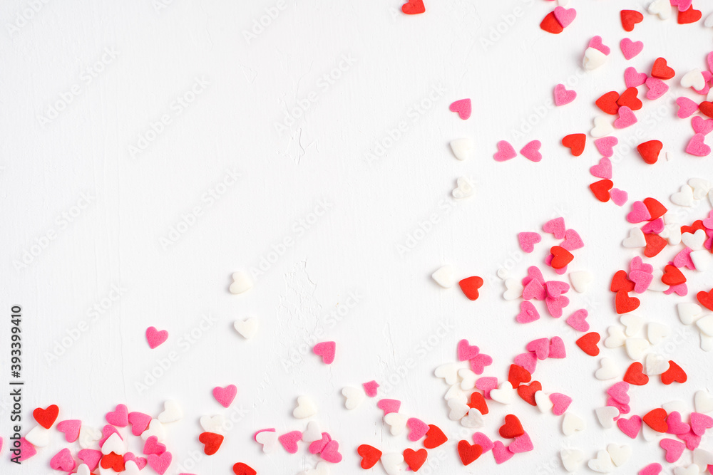 Small colored hearts on a light background. Side frame, top View, with space for copying. The Concept Of Valentine's Day.