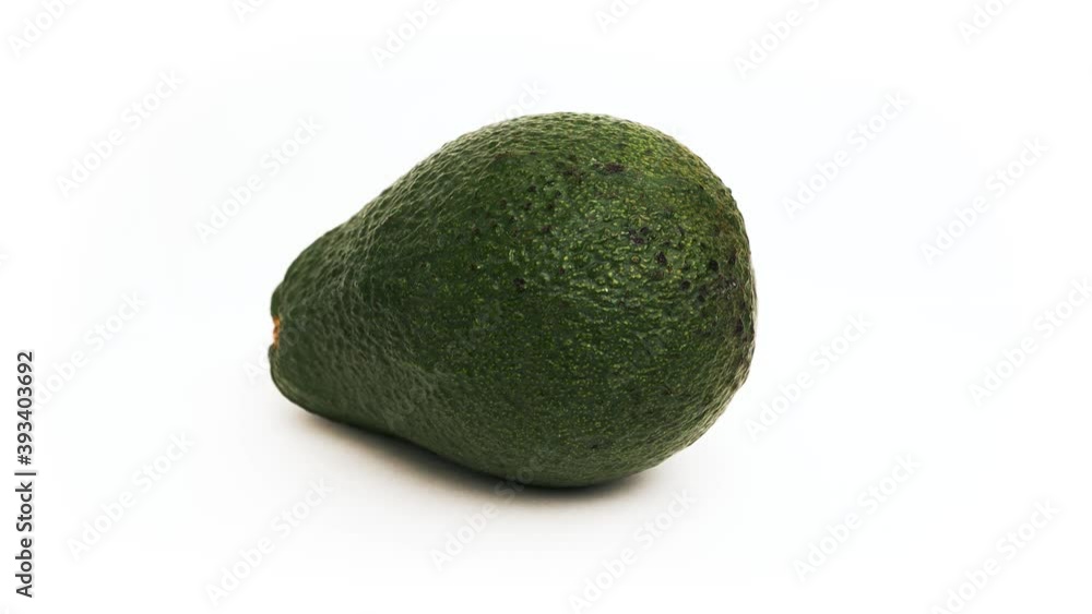 Fresh avocado closeup in the centre of the screen spins in 360 degrees Fresh avocado closeup in the centre of the screen spins in 360 degrees