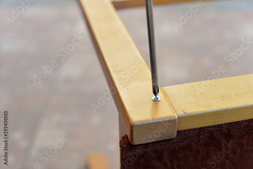 A series of photos of chair repair in the garden of the workshop, using tools: screw, screwdriver, drill, ruler.
