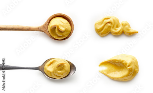 Fotografiet Set of mustard in spoons isolated on white background top view