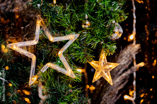Garland in shape of Led Christmas star in decor, blurred bokeh background