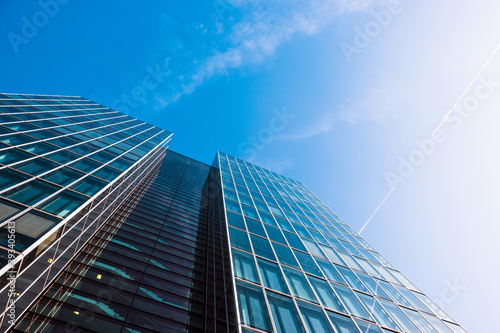 Scenic View from the Bottom of a Beautiful Modern Business Building with Blue Sky