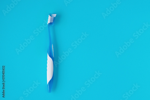 Empty space for text. New toothbrush on a blue background.